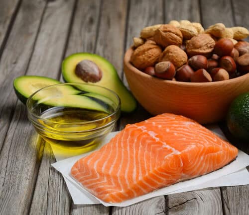 Selection of healthy fat sources. Rustic background.