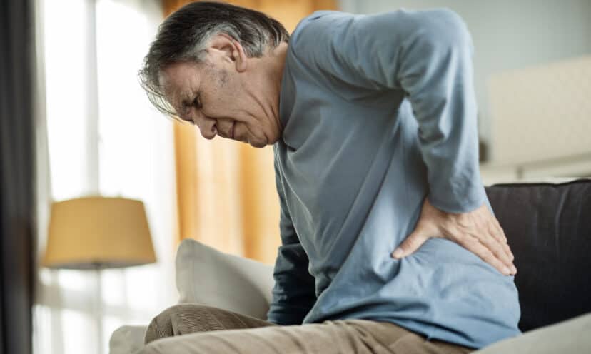 Old man suffering from kidney stone pain