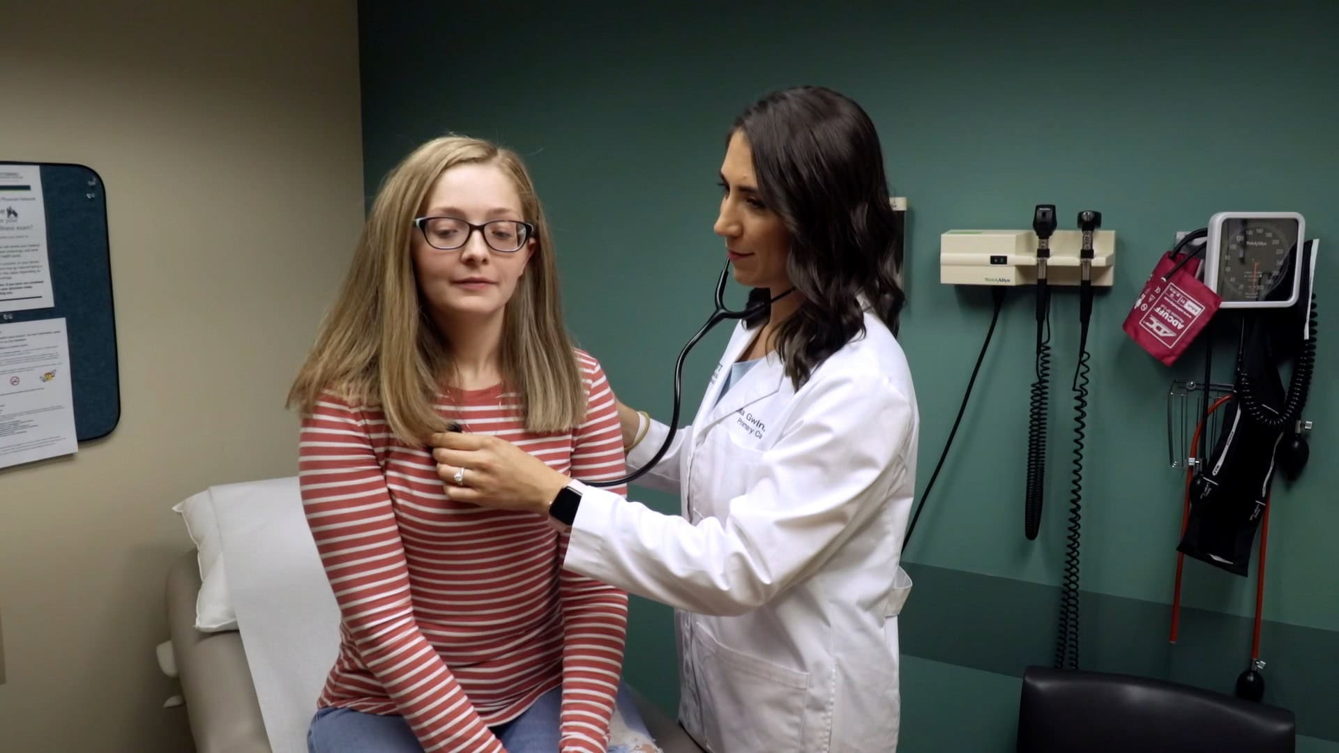 Dr. Lila Gwin listens to a patient's heart