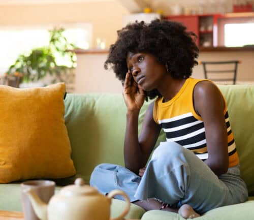 woman stressed on the couch