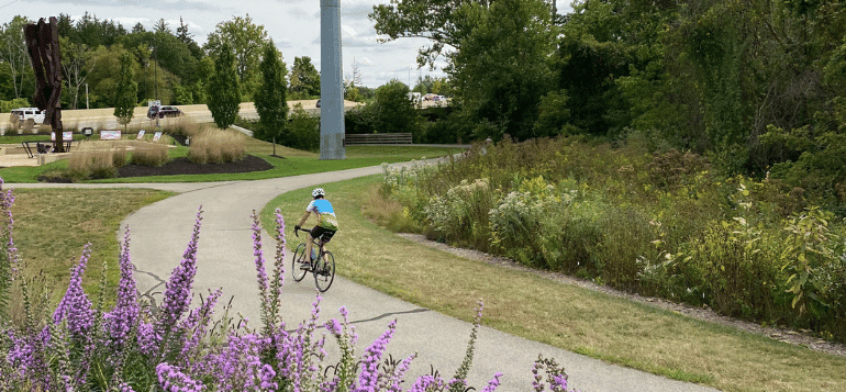 Person riding a bike on the bike path