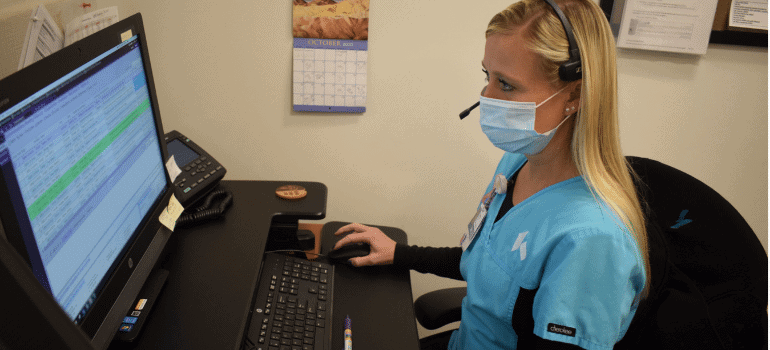 Provider sitting at computer
