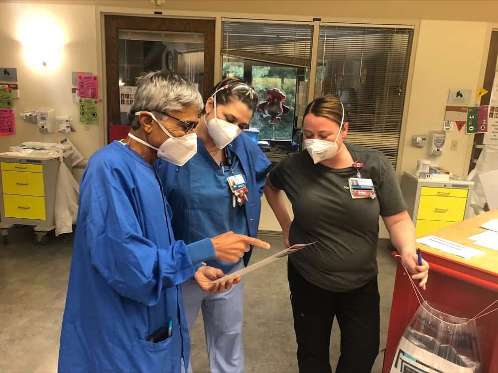 Dr. Shah speaking with nurses