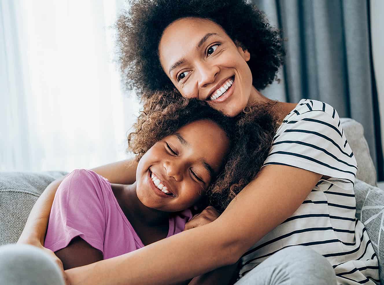 Mom hugging daughter