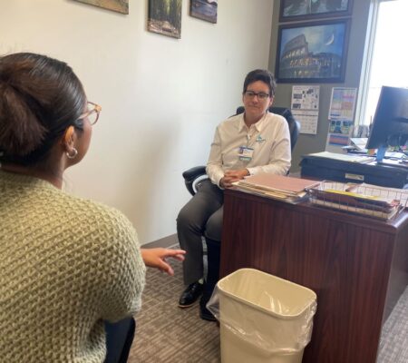 Julie discusses the holidays with a patient.