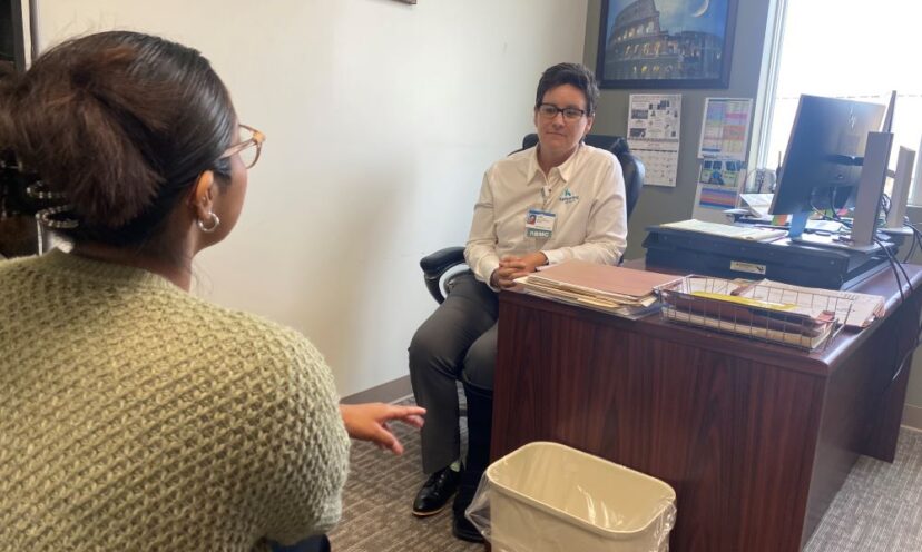 Julie discusses the holidays with a patient.