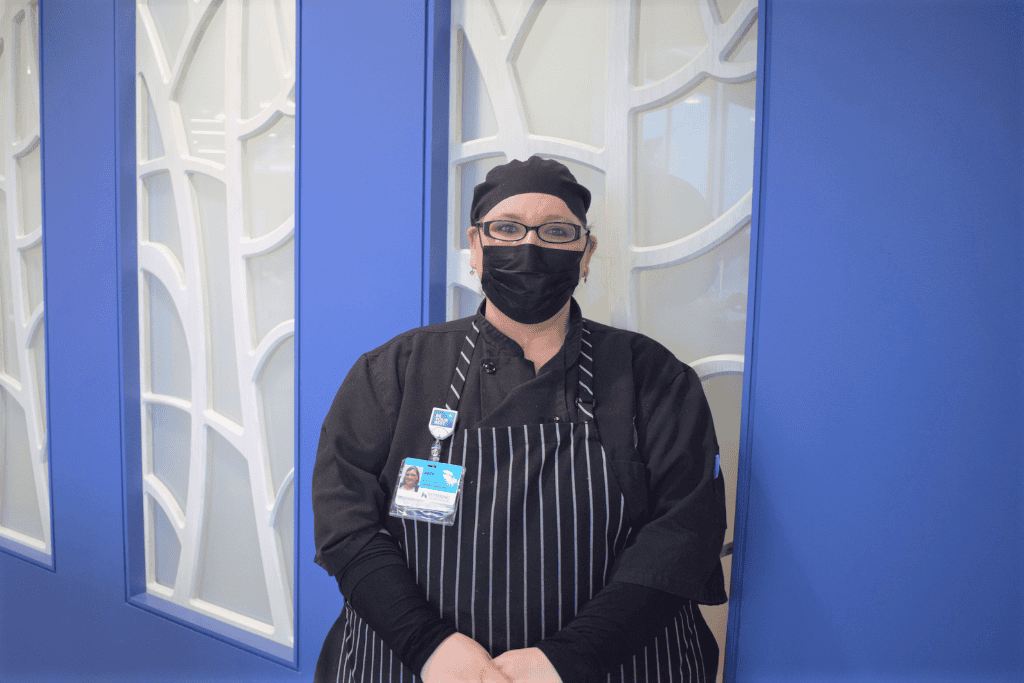 Jade Nohacs stands in front of wall at Kettering Health Miamisburg