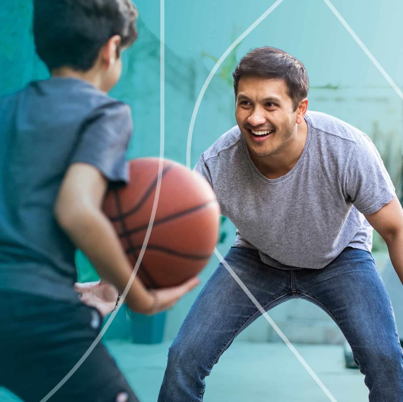 Father playing basketball with son