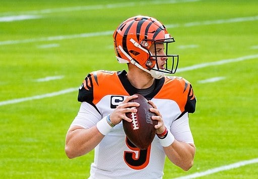 Joe Burrow, recently had appendicitis, throws a football