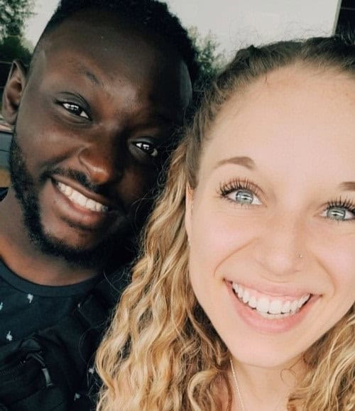 Gabby Wacker and her boyfriend smile into the camera