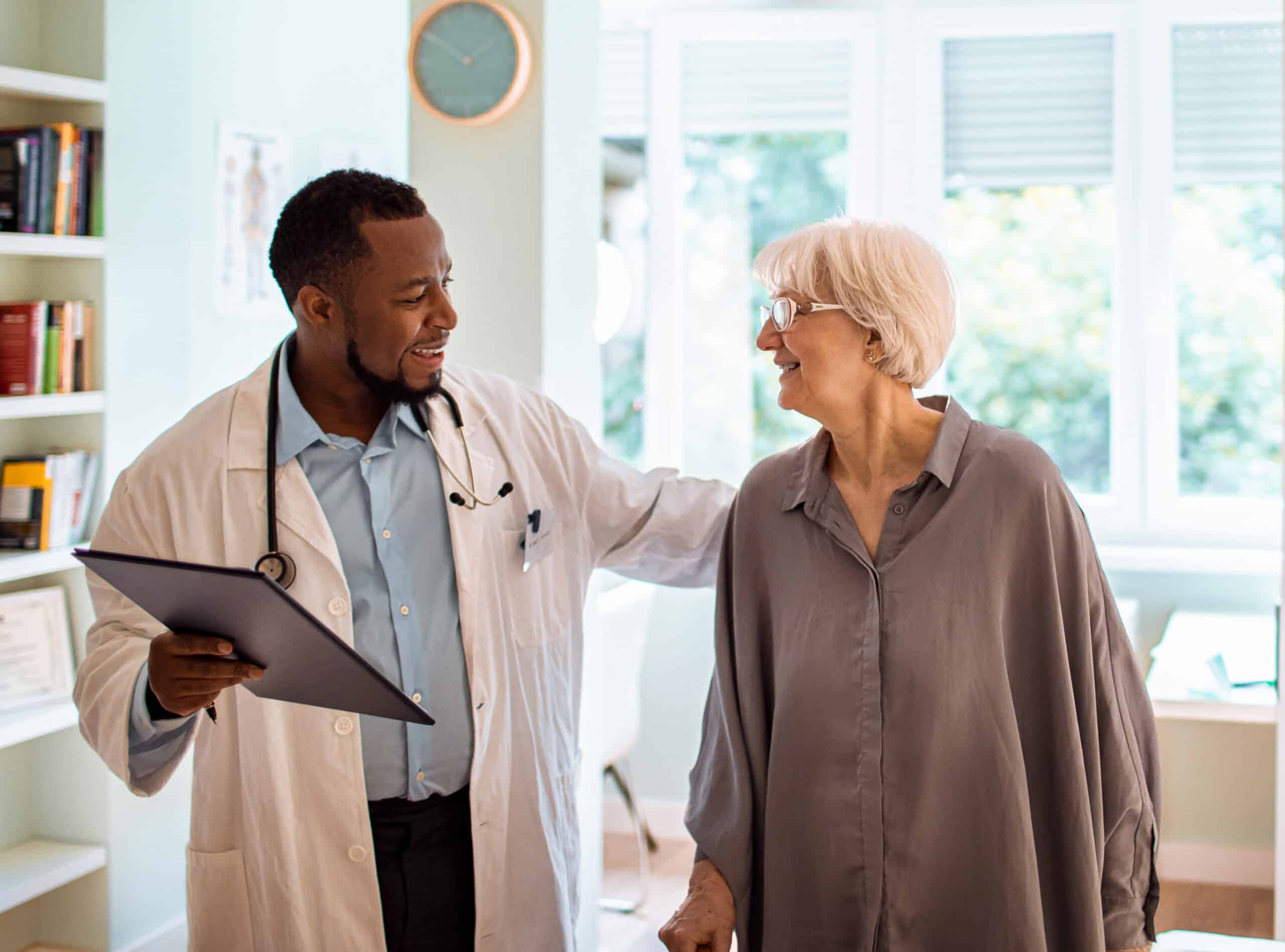 Doctor talking to older woman