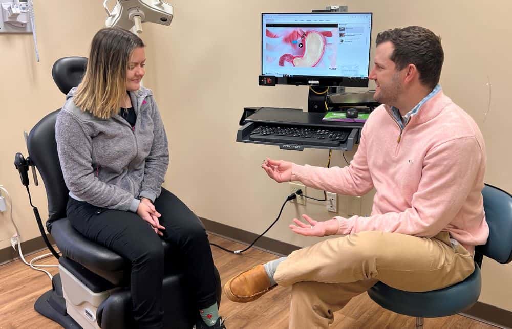 Dr. James Parker talking to patient about LINX