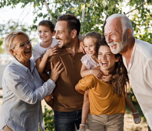 Cheerful extended family having fun in nature.