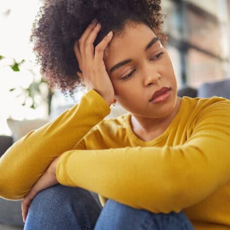young woman looking sad
