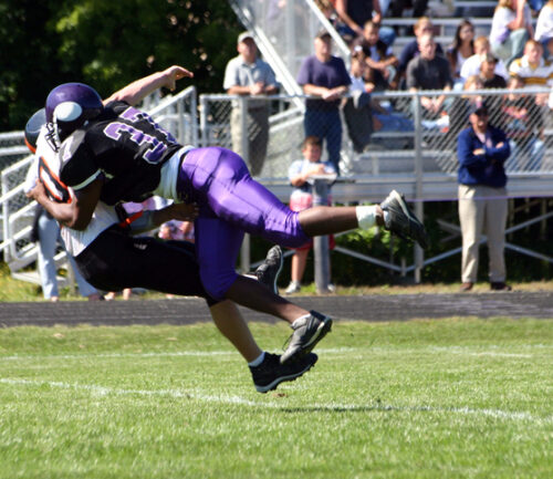 two football players colliding
