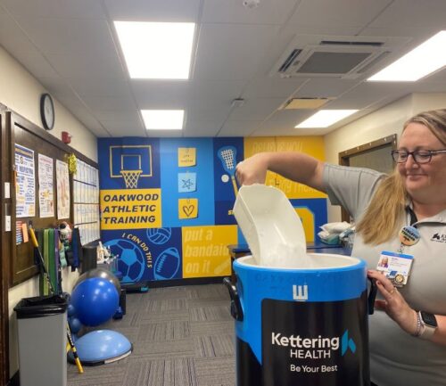 Women getting ice in athletic training center