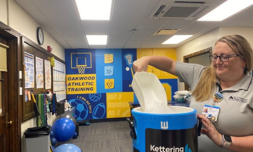 Women getting ice in athletic training center