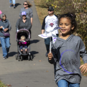 child walking at the annual circle of victory walk