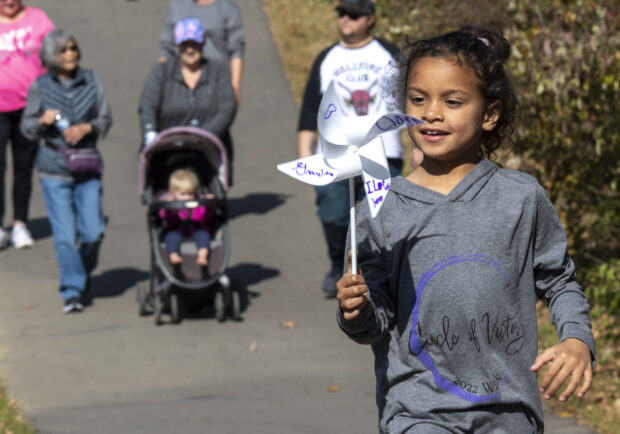 child walking at the annual circle of victory walk