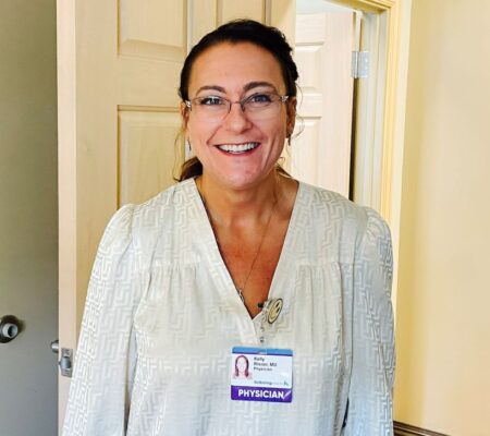 Dr. Kelly Risner smiling at camera