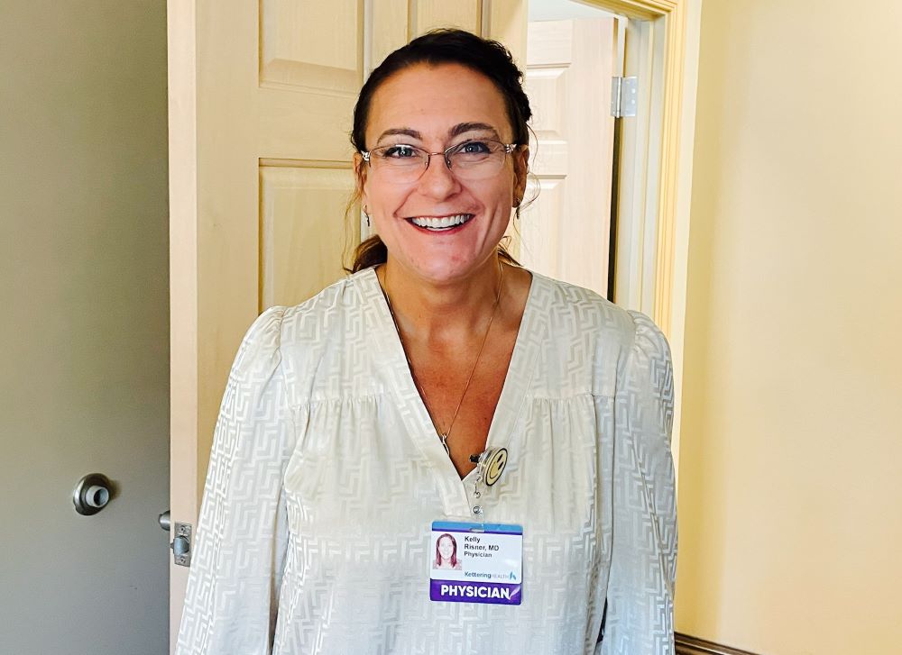 Dr. Kelly Risner smiling at camera