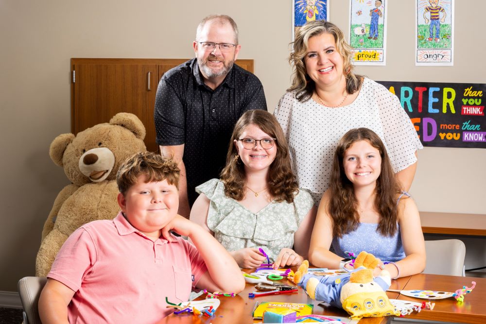 The Williamson family poses in the CLIMB program