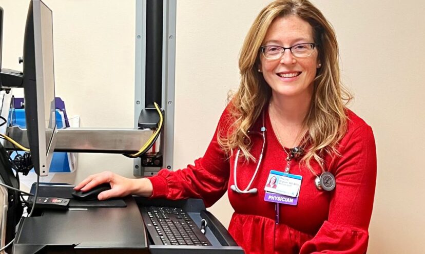 Dr. Deanna Allgeyer smiling at her desk
