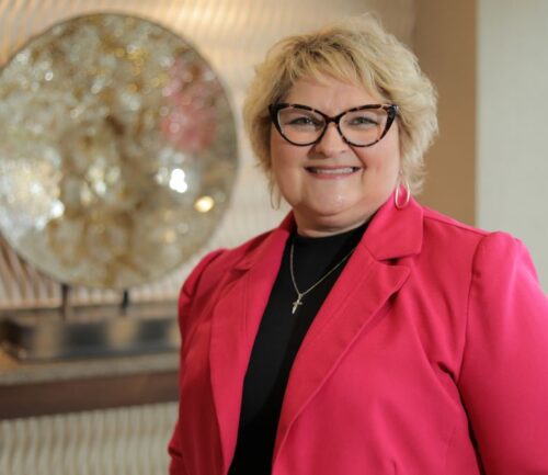 Heidi Siens, breast cancer patient, smiles at camera