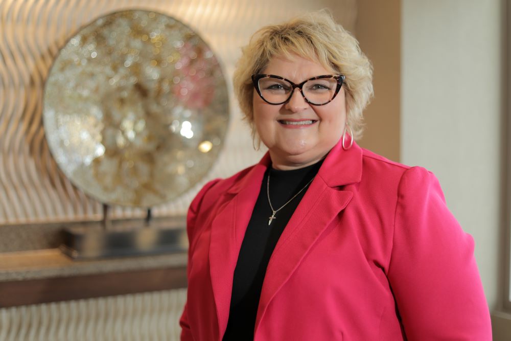 Heidi Siens, breast cancer patient, smiles at camera