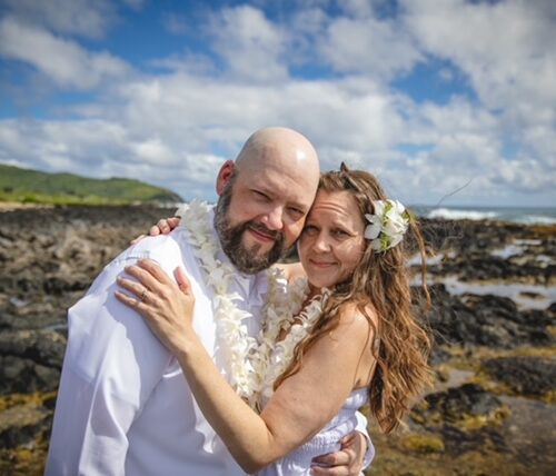 Sarah and her husband Tim pose during their wedding.