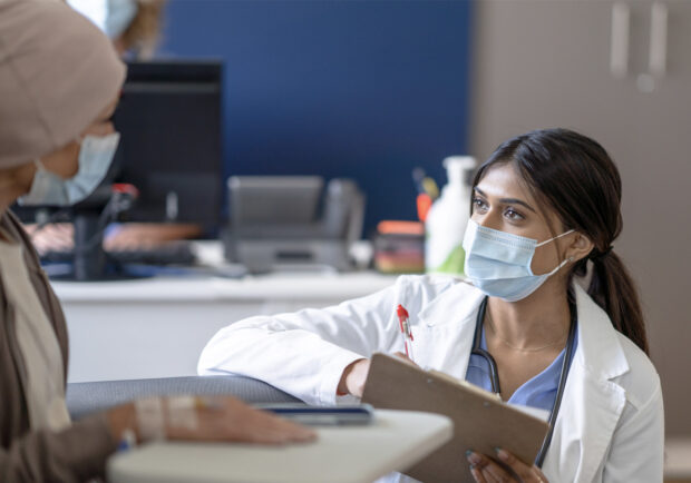 female provider talking to cancer patient