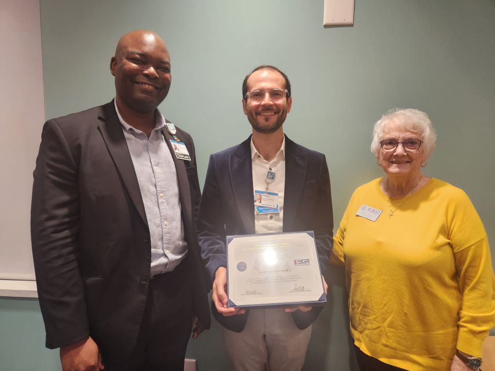 Chaplain Emeka Chaplain Nestor Bruno and Ms. Elizabeth Jackson presenting Bruno's award.