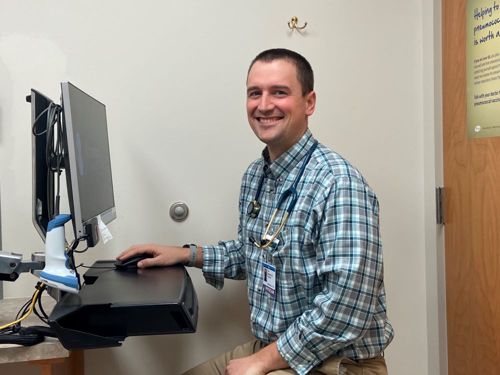 Dr. Bennett sitting in patient room