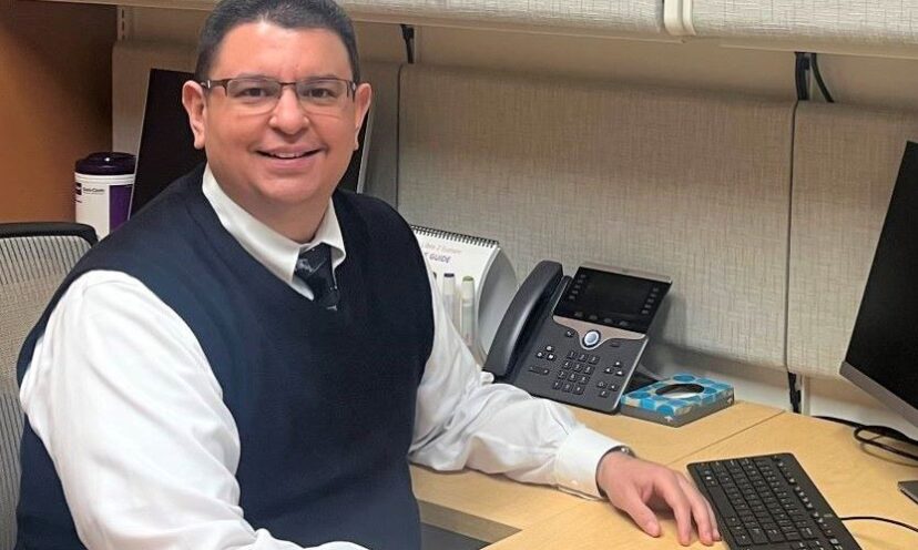 Dr. Carlos Ventura sitting at his desk