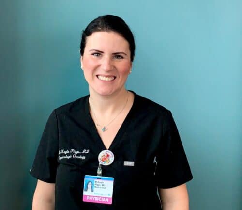 Dr. McKayla Riggs in front of a blue wall