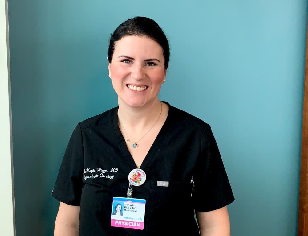 Dr. McKayla Riggs in front of a blue wall