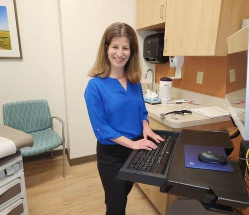 Dr. Keren Ray at computer in patient room