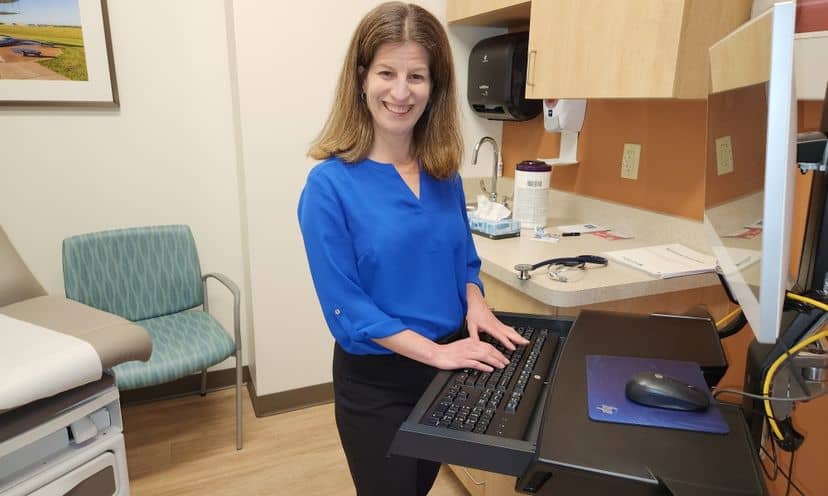 Dr. Keren Ray at computer in patient room