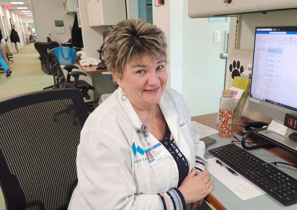 Kay Finch at her desk
