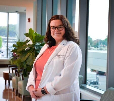 Dr. Rebecca Tuttle smiling in medical office