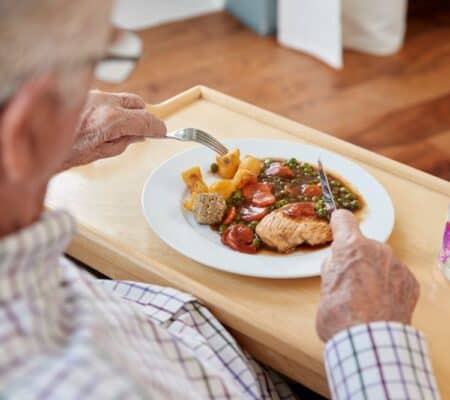 Man eating dinner at home