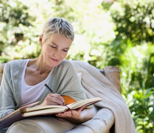Woman journaling outside