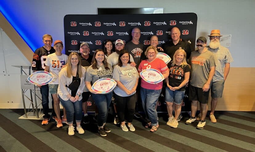 Cancer patient survivors and patients at Topgolf with Bengals Legends