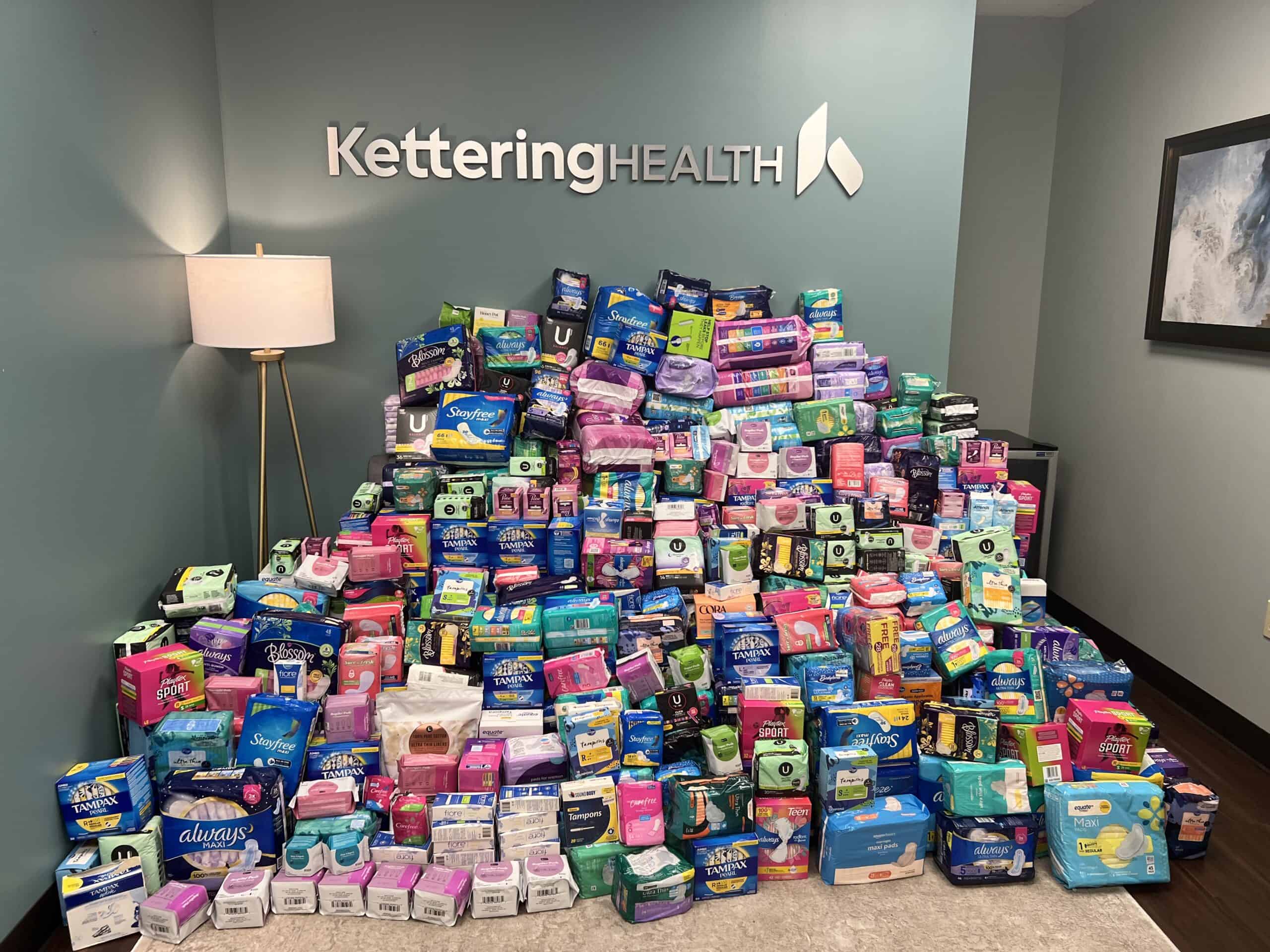 Boxes of period products stacked in a pile