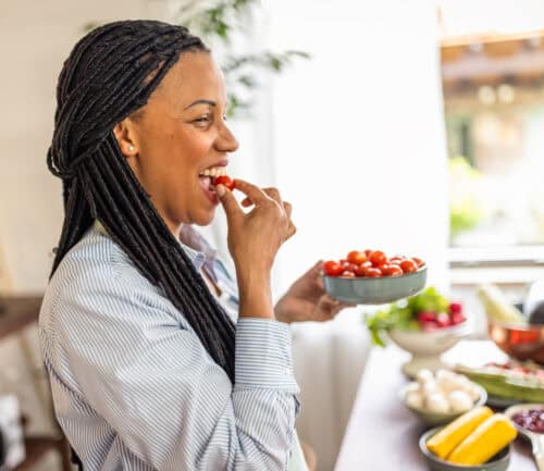 Woman eating fruits and vegetables
