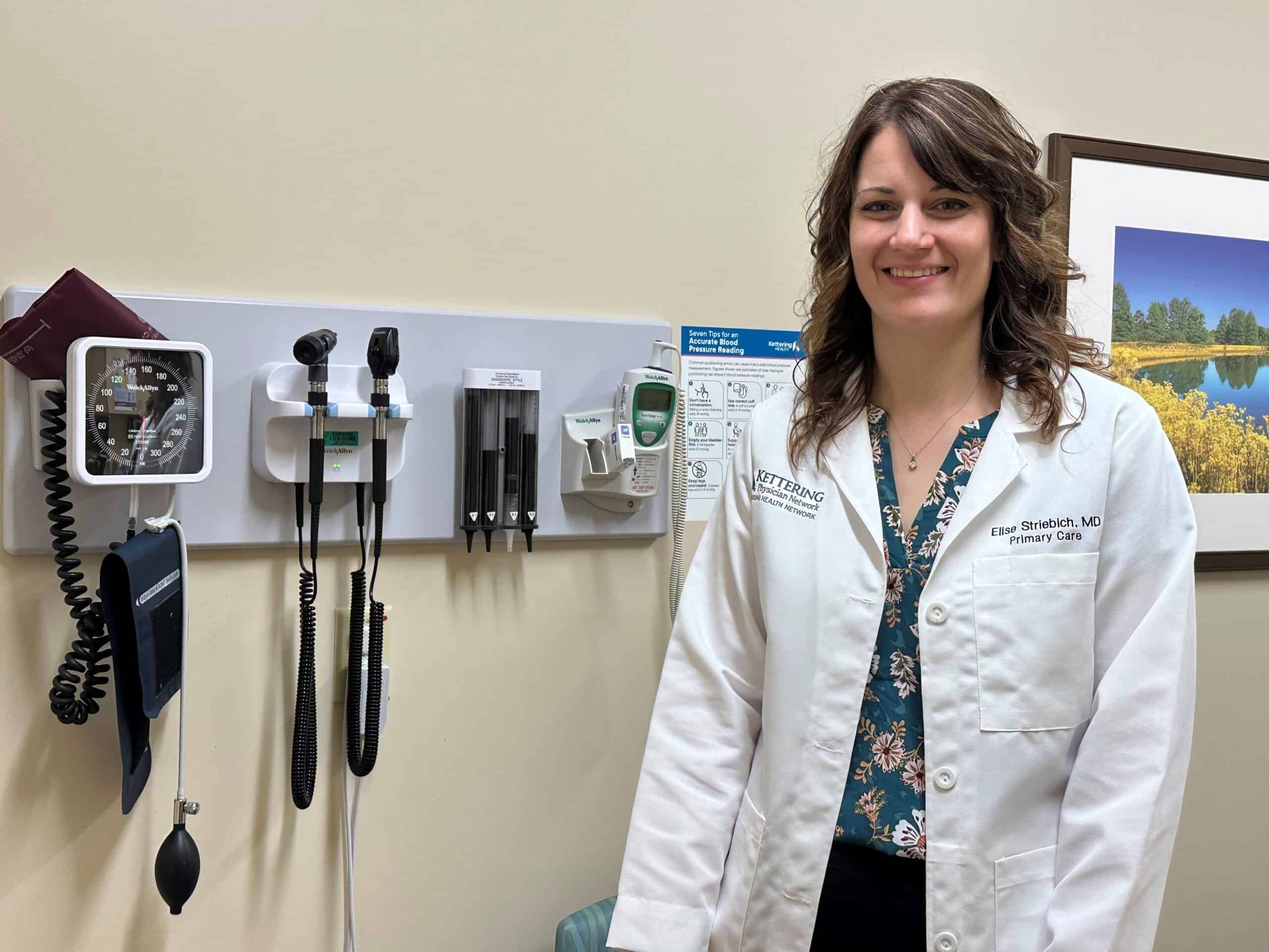 Doctor standing in patient room