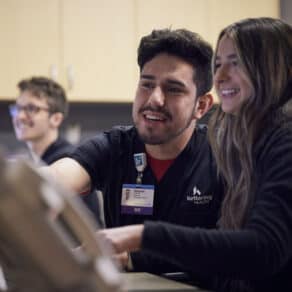 Nurses talking at their desk