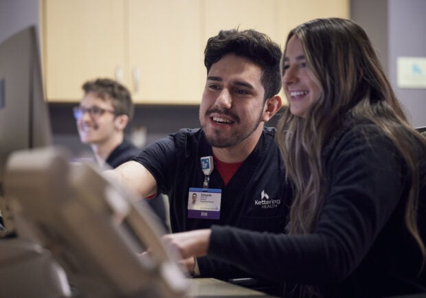 Nurses talking at their desk