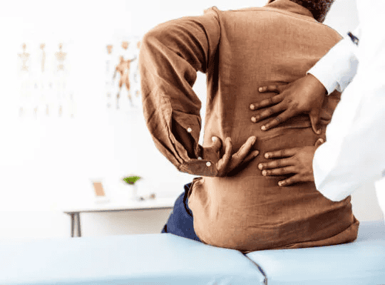 Patient showing their back pain