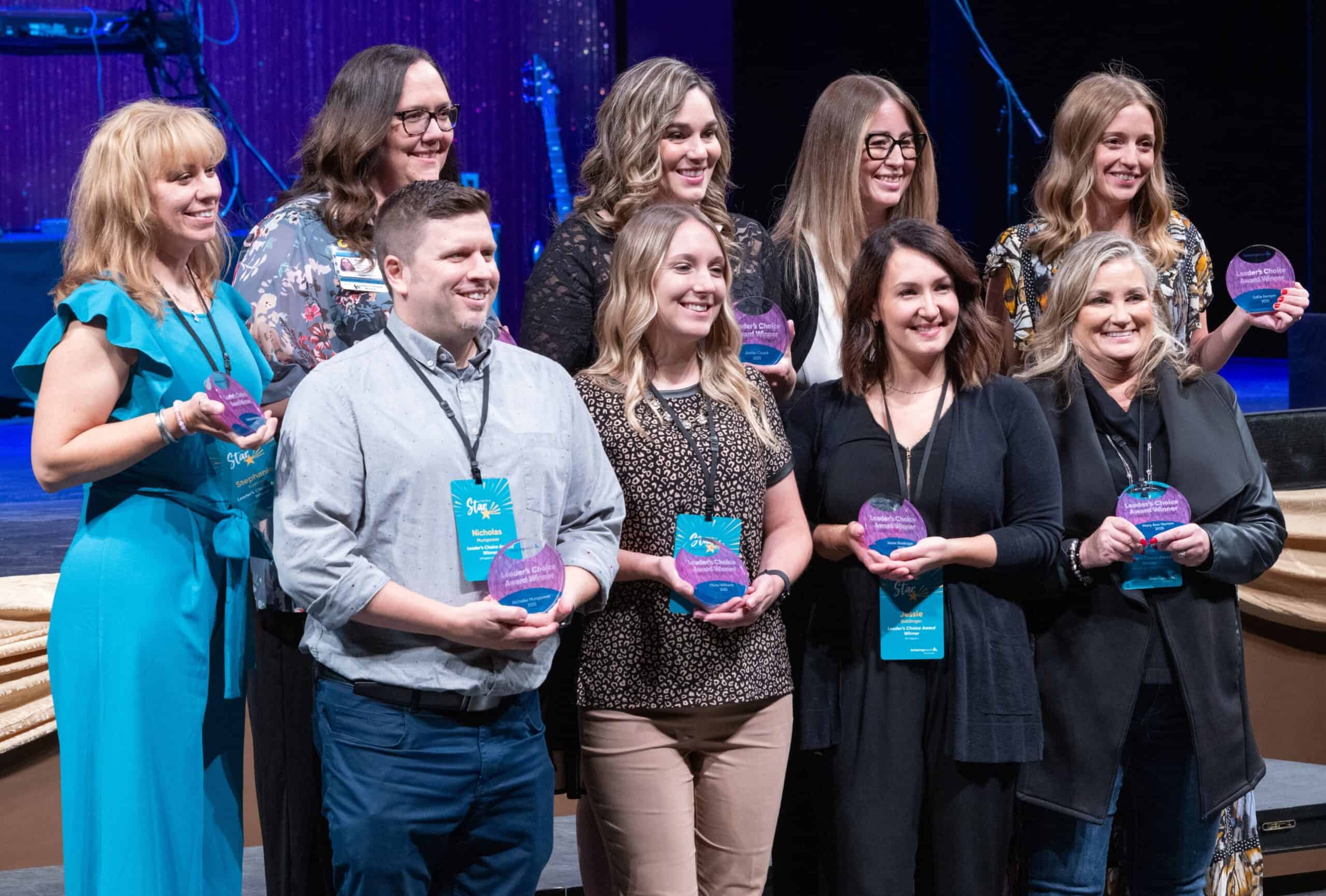 Leader's Choice Award winners posing with their awards